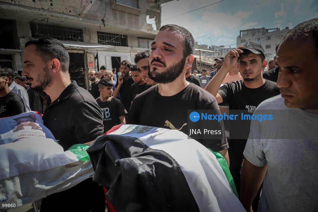 GAZA CITY, GAZA STRIP, OCTOBER 1, 2026: Palestinian families bid farewell to the remains of 105 Palestinians whose bodies were recovered from beneath the rubble of the Al-Taj residential area in Gaza City. The victims were killed in Israeli airstrikes on October 25, 2023, when residential buildings in the Yarmouk area were destroyed. Gaza Civil Defense teams recovered the bodies and remains after a 17-day search operation carried out in coordination with an Egyptian committee. Families gathered to identify their relatives and pay their final respects before burial. Photo by Mohammed M. Skaik / JNA Press. (Photo by Mohammed M Skaik/JNA Press via Nexpher Images)