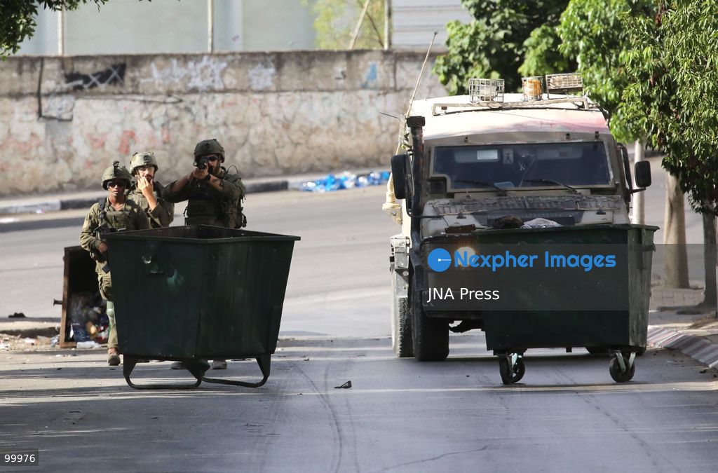 NABLUS, OCCUPIED WEST BANK, OCTOBER 1, 2026: Israeli soldiers guard Israeli settlers during a raid on Joseph's Tomb in the eastern part of Nablus. Hundreds of Israeli settlers entered the site to perform Jewish religious rituals under heavy protection from Israeli forces, which deployed military vehicles and imposed security restrictions around the area. Photo by Nedal Shtieh / JNA Press. (Photo by Nedal Shtieh/JNA Press via Nexpher Images)