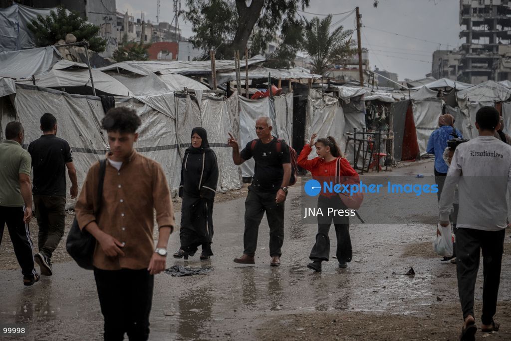 GAZA CITY, GAZA STRIP, OCTOBER 1, 2026: Palestinians go about their daily lives amid rainfall in Gaza City as rain affects streets and residential areas on Thursday evening. Photo by Mohammed M. Skaik / JNA Press. (Photo by Mohammed M Skaik/JNA Press via Nexpher Images)